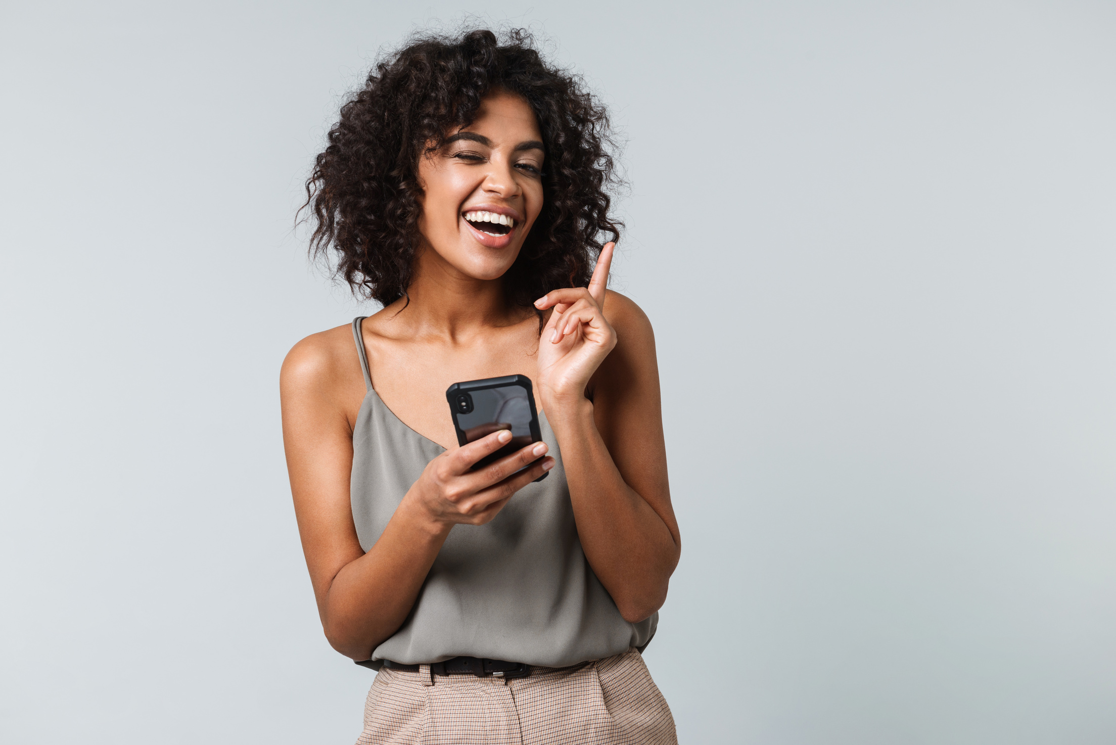 Happy Young African Woman with Mobile Phone